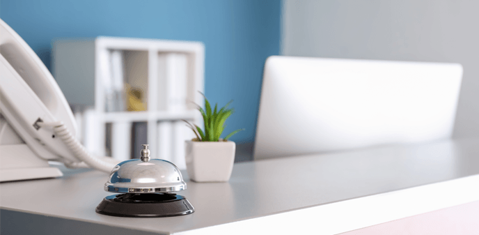 受付カウンターと電話機のイメージ（おしゃれな受付）